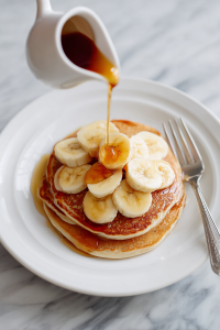 Serve with banana slices and maple syrup.