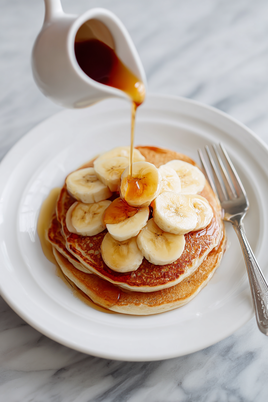 Serve with banana slices and maple syrup.
