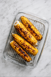Spread Mexican crema over grilled corn.