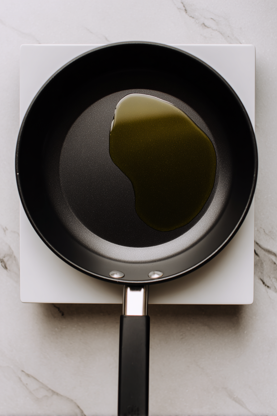 Heat cooking oil in a pan to 350°F over medium-high heat.