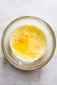 Whisk together egg and milk in a medium-sized shallow bowl.