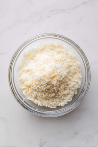 In a second shallow bowl, mix shredded coconut, Panko breadcrumbs, and salt.