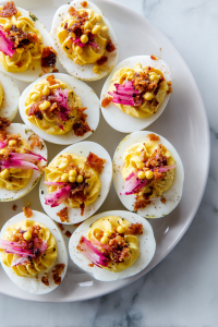 Top with pickled mustard seeds and cracklin’ for added flavor and texture.