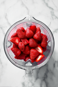 Toss washed and hulled strawberries into a high-speed blender or food processor. Blend until smooth or reach your preferred consistency.