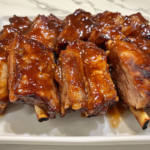 Easy Pork Ribs With Peach & Molasses Glaze is ready to serve