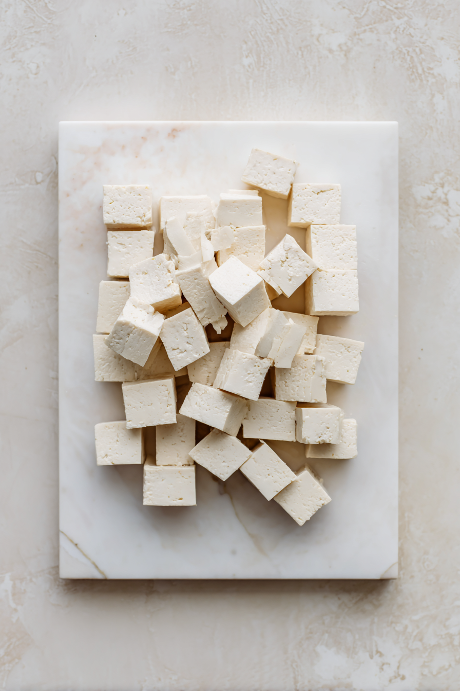 Prepare the Tofu: Cut the tofu into small cubes and set aside.
