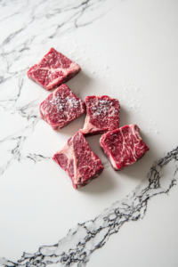 Preparing Well-Seasoned Lone Mountain Wagyu Chuck Steaks for the Bacon and Tomato Balsamic Steak Recipe