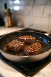 Searing Delicious Lone Mountain Wagyu Steaks in a Hot Skillet for the Bacon and Tomato Balsamic Steak Recipe
