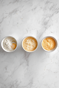 Setting Up the Dredging Station for Crispy Pork Chops with Pea Shoot Salad