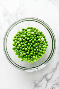 Soak the peas: Rinse dried peas under cold water and soak them in a bowl of water for a few hours or overnight to soften.