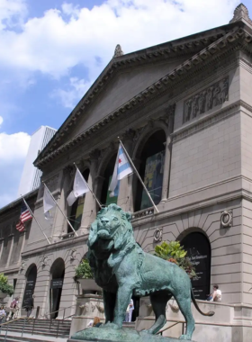  A captivating view of a modern architectural building in Chicago, showcasing sleek lines and innovative design. The structure features large glass windows reflecting the surrounding cityscape. This image highlights the blend of contemporary architecture with urban life, symbolizing Chicago’s reputation as a hub for architectural excellence.