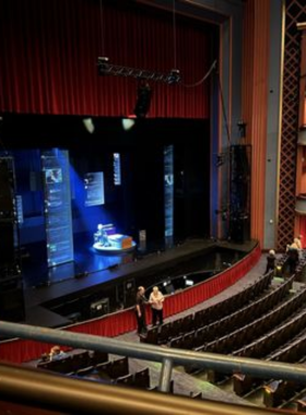 Interior of Cozy Cafe "A cozy cafe interior with warm lighting, wooden furniture, and patrons enjoying drinks in a relaxed, inviting ambiance."