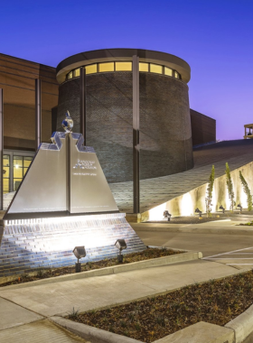 Holocaust Museum Entrance "Front view of the Holocaust Museum in Houston, showcasing its modern architectural design with a solemn, commemorative atmosphere."