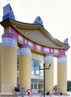 Moody Mansion in Texas "The historic Moody Mansion in Galveston, Texas, with grand red brick architecture and intricate white detailing on a sunny day."