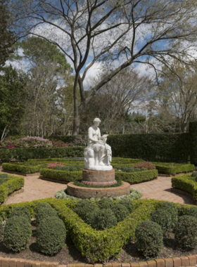 Bayou Bend Gardens "A beautiful view of Bayou Bend Gardens with manicured landscapes, lush greenery, and historic architecture set amidst tranquil scenery."