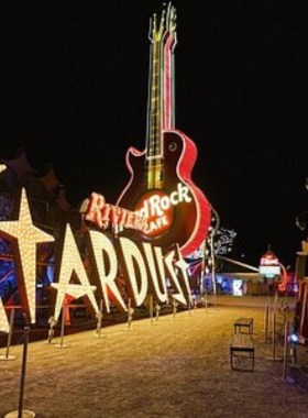 urban-building-night-view.jpg Illuminated exterior of a building in an urban setting at night, highlighting modern architecture and vibrant city lights.