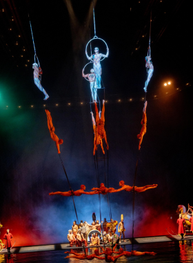 cirque-du-soleil-performance.jpg Cirque du Soleil performance in Las Vegas, showcasing acrobatic artists in vibrant costumes performing on stage, blending theater, dance, and aerial stunts.
