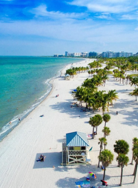 Miami_Sunset_Skyline Captivating sunset view over Miami's skyline, showcasing the city's iconic skyscrapers illuminated by vibrant colors reflecting off the water, creating a picturesque evening atmosphere.