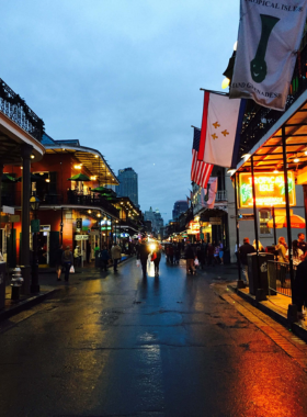Frenchmen_Street_Music_Scene Street musicians performing on Frenchmen Street in New Orleans, surrounded by crowds enjoying the live music, capturing the vibrant cultural and musical energy of the area.