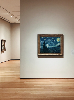 Starry_Night_MoMA_Display Vincent van Gogh’s “Starry Night” displayed at the Museum of Modern Art (MoMA) in New York City, capturing the swirling night sky and luminous stars in this iconic artwork.