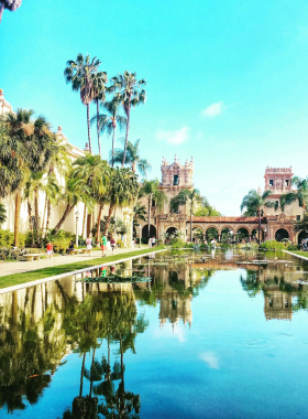The Old Point Loma Lighthouse in San Diego, located at the Cabrillo National Monument. The image captures this historic 19th-century lighthouse surrounded by coastal landscape and blue skies. The Point Loma Lighthouse is a significant landmark offering visitors insight into maritime navigation history and stunning ocean views.
