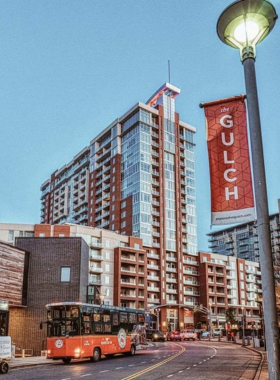 Neon sign marking The Gulch neighborhood in Nashville, showcasing vibrant nightlife.
