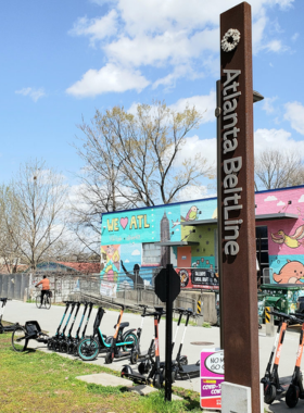 Atlanta BeltLine Walking Path A scenic walking path along the Atlanta BeltLine, bordered by trees and greenery, frequented by locals and tourists alike for walking, jogging, and biking in a natural setting.