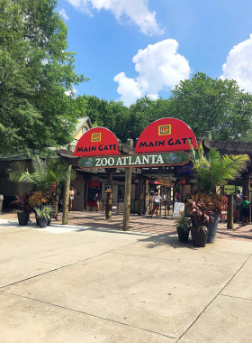 Atlanta Event Venue with Elegant Decor An elegant Atlanta event venue with sophisticated decor, featuring chandeliers, lavish table settings, and a well-lit dance floor, creating a luxurious setting for special occasions.