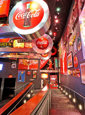 Atlanta Event Venue with Elegant Decor An elegant Atlanta event venue with sophisticated decor, featuring chandeliers, lavish table settings, and a well-lit dance floor, creating a luxurious setting for special occasions.