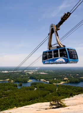 Summit Skyride at Stone Mountain Park The Summit Skyride at Stone Mountain Park, a blue cable car that takes visitors up the mountain for panoramic views of the surrounding landscapes, providing a unique aerial perspective.