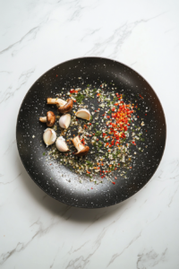 Heating the pan and melting butter for Grilled Cheese with Mushrooms, Garlic, Chili, and Oregano