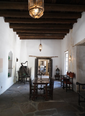 Industrial machinery in an urban setting: A close-up of complex machinery set against an urban backdrop. Metal gears and chains dominate the image, showcasing the intricate design and function within a city landscape.