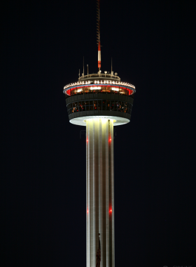 Aerial view of a sprawling urban landscape A wide, aerial shot of a dense cityscape featuring tall buildings, greenery, and a river running through the middle. The image captures the vastness and structural beauty of the city's layout.