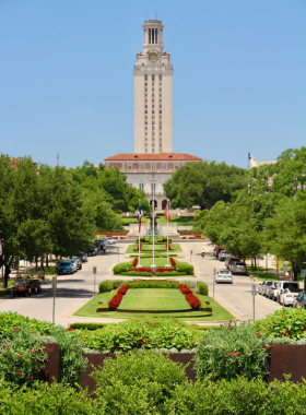 UT Tower at the University of Texas: A striking view of the University of Texas Tower, an iconic landmark on campus. The tower stands tall against a clear blue sky, symbolizing education and history in Austin.