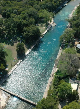 Sunset over Lake Travis: A breathtaking view of a sunset over Lake Travis, with the sky painted in hues of orange, pink, and purple. The calm waters reflect the vibrant colors, creating a picturesque landscape perfect for relaxation and photography.