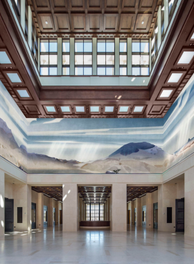 beyondthebayoublog - 2024-11-04T171831.642 "An aerial view of the Winspear Opera House in Dallas Arts District, Texas, with its modern architecture and vibrant red roof, surrounded by urban buildings."