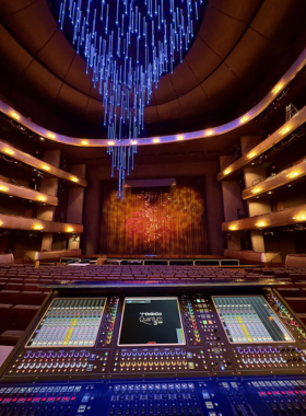 AT&T_PAC_Auditorium_Concert.jpg "The interior view of an auditorium at the AT&T Performing Arts Center in Dallas, Texas, showing professional stage lighting and sound equipment setup."