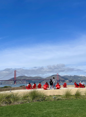 Presidio_Tunnel_Tops.jpg A panoramic view of the Presidio Tunnel Tops, showcasing beautifully landscaped parks with walking trails, picnic areas, and views of the Golden Gate Bridge. Families and friends are enjoying the open space on a sunny day.