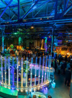 Golden_Gate_Bridge_Sunset.jpg The iconic Golden Gate Bridge spanning across a calm bay, with the city of San Francisco visible in the background. The bridge's bright orange color contrasts beautifully against the blue sky and water, making it a striking landmark in the area.