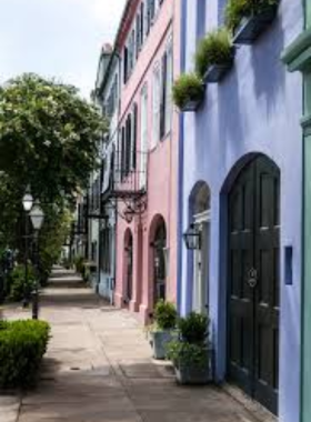 Rainbow_Row_Charleston.jpg A colorful row of historic homes known as Rainbow Row, featuring pastel hues that create a cheerful atmosphere. The charming architecture reflects Charleston’s rich history and architectural diversity, inviting visitors to explore the area.