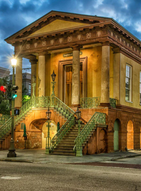 Charleston_City_Market.jpg A bustling scene at the Charleston City Market, filled with shoppers browsing local crafts and goods. Colorful stalls display handmade items, capturing the vibrant local culture and the lively atmosphere of this historic marketplace.