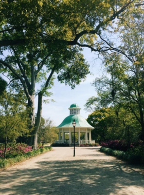 Hampton_Park_Bandstand.jpg A beautifully designed bandstand located in Hampton Park, surrounded by vibrant flowers and lush greenery. The structure serves as a focal point for community events and outdoor concerts, embodying the lively spirit of Charleston's outdoor culture.