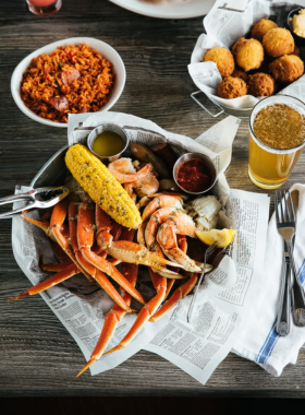 Steamed_Crab_Pot_Charleston.jpg A deliciously arranged seafood platter featuring steamed crabs, accompanied by corn on the cob and potatoes. The vibrant colors of the crab shells contrast with the earthy tones of the vegetables, showcasing the rich culinary tradition of Charleston’s seafood cuisine.