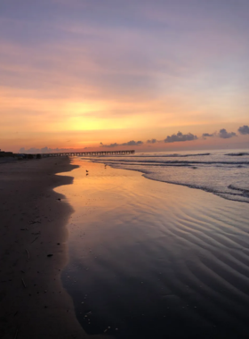 Charleston_Boat_on_Water.jpg A picturesque scene of a small boat anchored on the tranquil waters of Charleston, surrounded by lush greenery and marshland. The boat reflects the bright blue sky above, dotted with soft, white clouds, creating a serene and inviting atmosphere. This image captures the natural beauty of Charleston’s coastal environment, showcasing the peacefulness and charm of a day spent on the water.