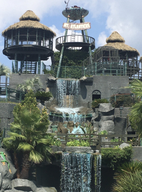 Beach_Building_Sandcastles_Myrtle_Beach A family having fun building sandcastles at Myrtle Beach, with gentle waves in the background. The wide sandy shore is a perfect spot for families to enjoy beach activities together.
