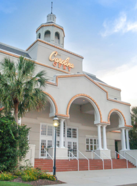 Carolina_Opry_Show_Performance A lively performance at the Carolina Opry in Myrtle Beach, showcasing musicians and dancers. The show features a mix of country, rock, and comedy, creating an entertaining experience for visitors.