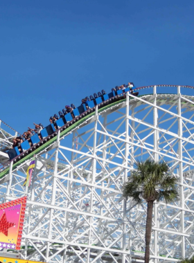 Myrtle_Beach_Ferris_Wheel A vibrant Ferris wheel at Myrtle Beach illuminated against the evening sky. The giant wheel provides spectacular views of the ocean and surrounding areas, offering an exciting ride for families and tourists.
