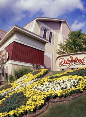 Dollywood_Park_Entrance The entrance to Dollywood in Pigeon Forge, with signage and flower arrangements welcoming visitors to this popular theme park. The park is a top attraction in the Smoky Mountains.