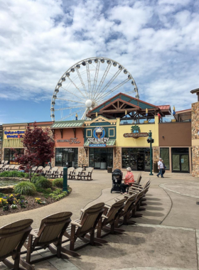 The_Island_Pigeon_Forge The Island at Pigeon Forge, featuring a beautiful outdoor fountain and shopping area. The location is a popular entertainment and shopping destination, bustling with activity and visitors.