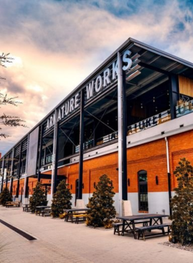 Armature Works Food Hall A vibrant food hall at Armature Works, showcasing a variety of delicious foods and beverages from local vendors, with guests enjoying meals and drinks while overlooking the Hillsborough River.